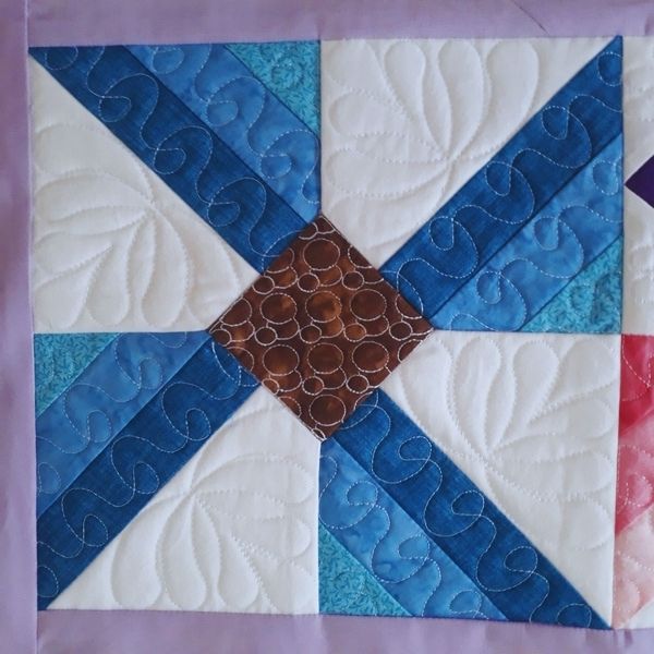 EWV228  Flutterby Quilted Table Topper
