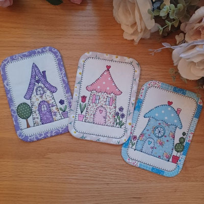 EW521 - ITH Country Cottages Applique Mug Rugs