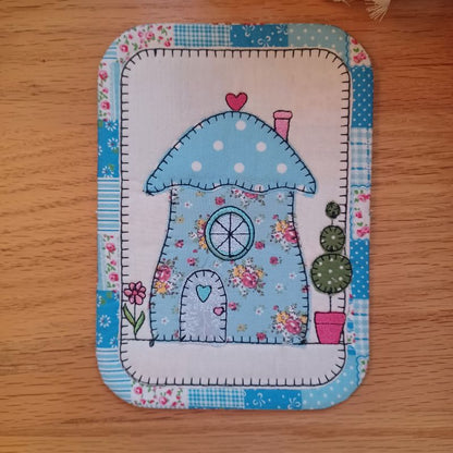 EW521 - ITH Country Cottages Applique Mug Rugs