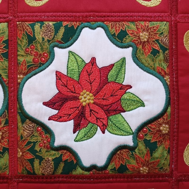 EWC273 - ITH Poinsettia Table Topper