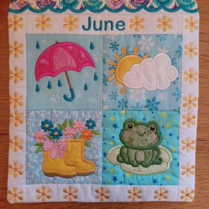 Close-up of ITH mini house quilt June embroidery design showing embroidery and appliqué details